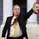 Illustration for article titled Defiant Mitch McConnell Holds Merrick Garland’s Severed Head Aloft In Front Of Capitol Building